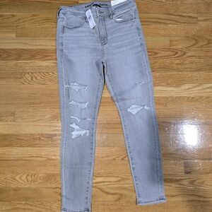 NWT american eagle high rise jeggings gray with rips in both legs